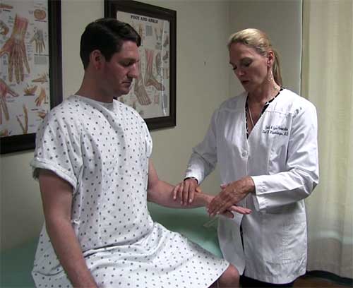 Designated doctor conducting an exam