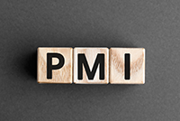 wooden blocks with the letters P, M, and I on a dark background.