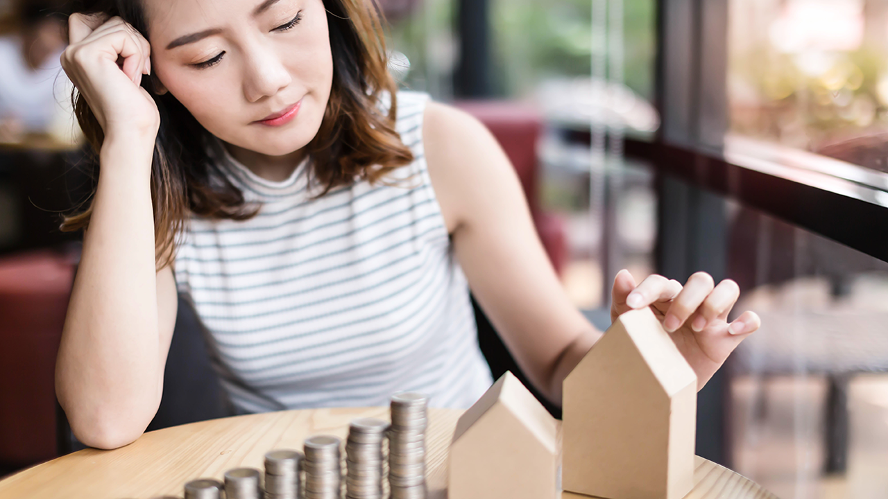 Woman stacking coins