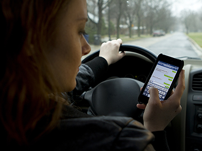 Driver using her phone