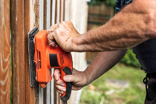 Vibration safety - fence builder using an electric sander
