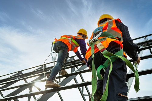 Construction workers wearing fall protection