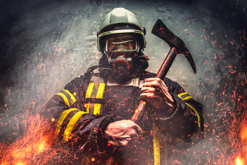 Firefighter with an axe and helmet