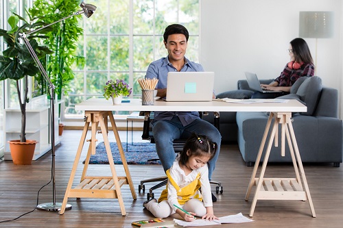 Man and woman working from a home office