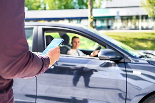 Person looking at ride-sharing app on phone