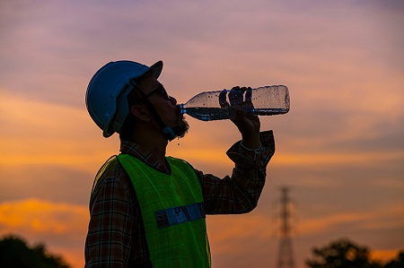 Construction worker staying hydrated