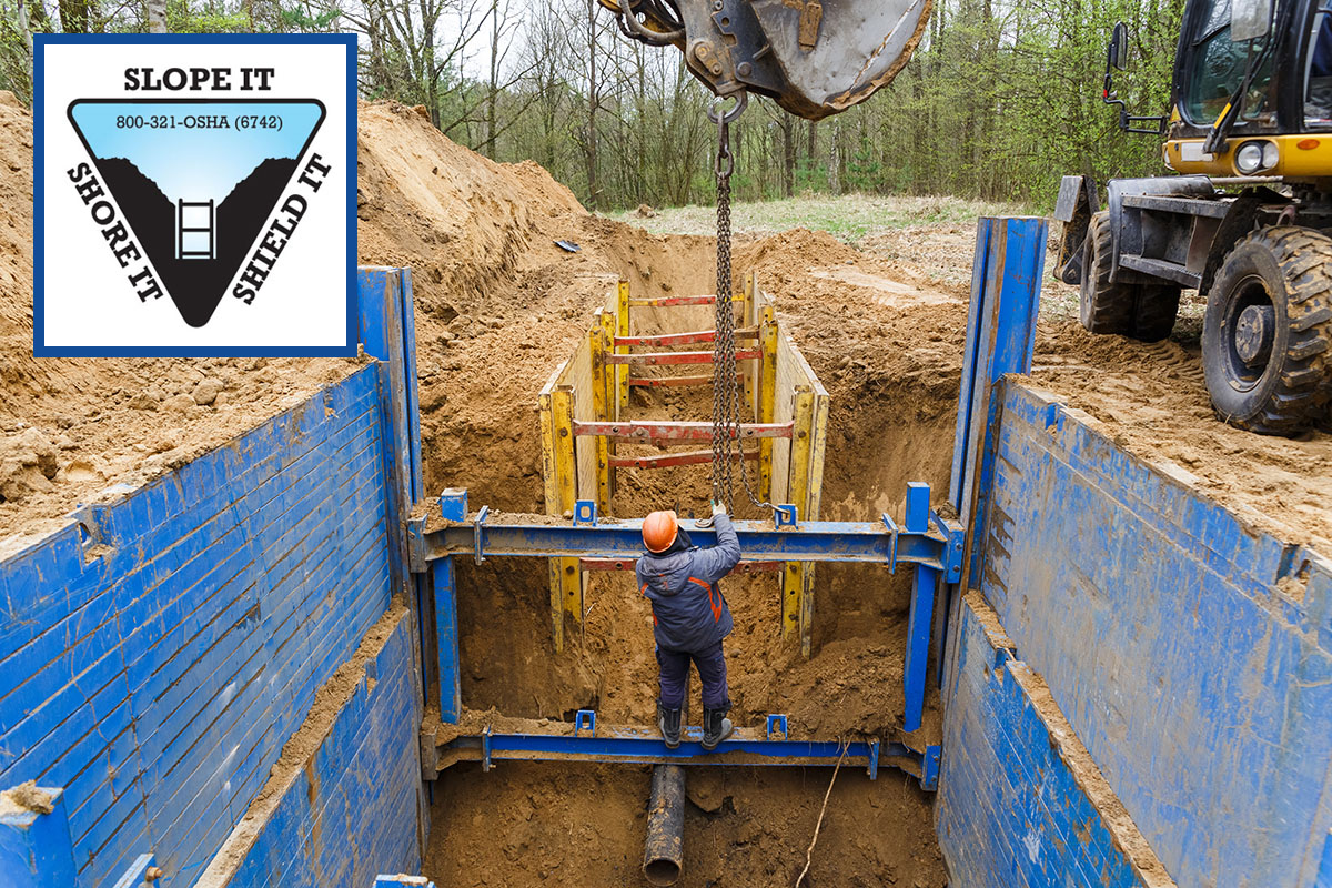Worker in a trench with a trench shield